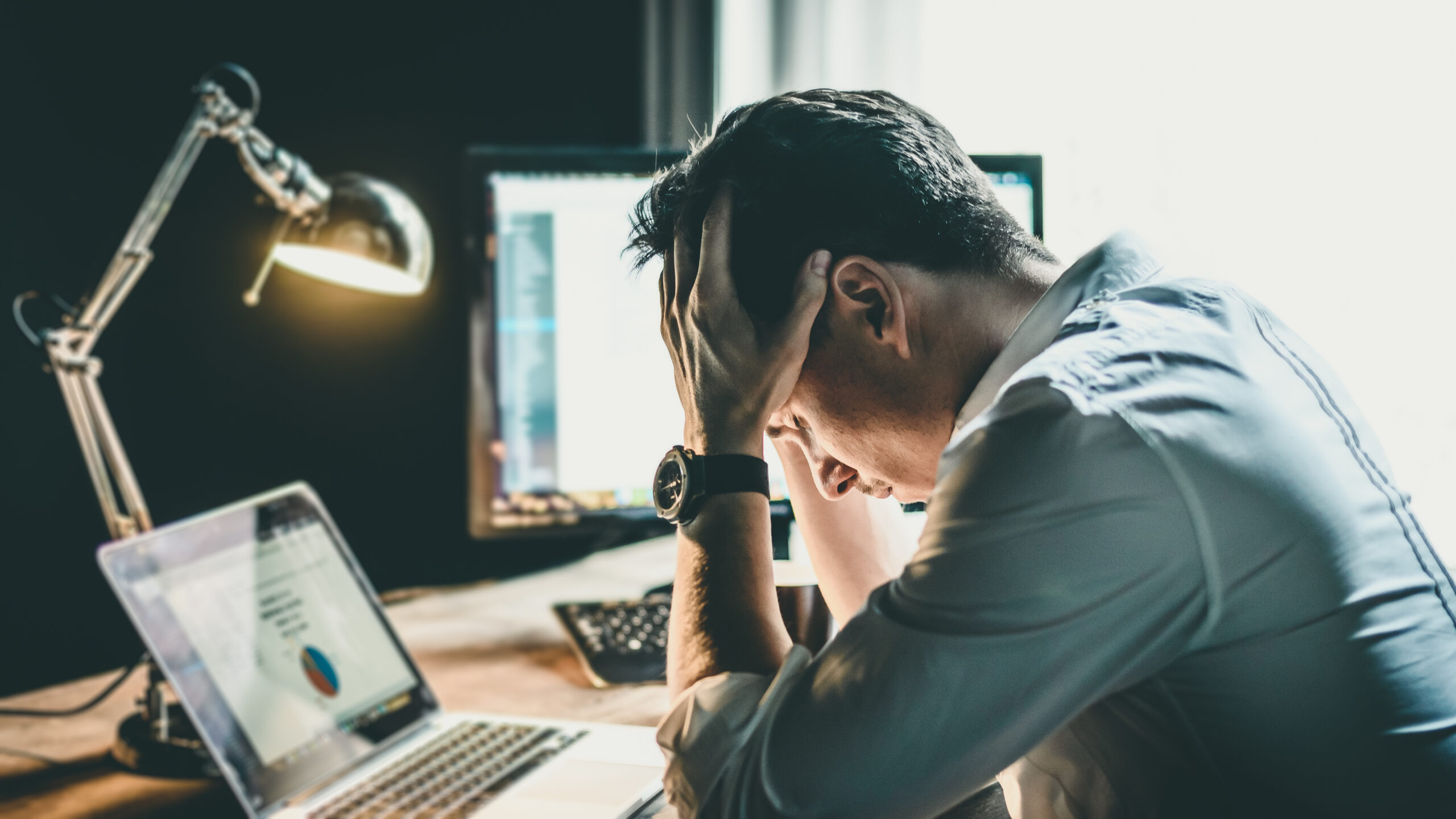 Tired,And,Worried,Business,Man,At,Workplace,In,Office,Holding